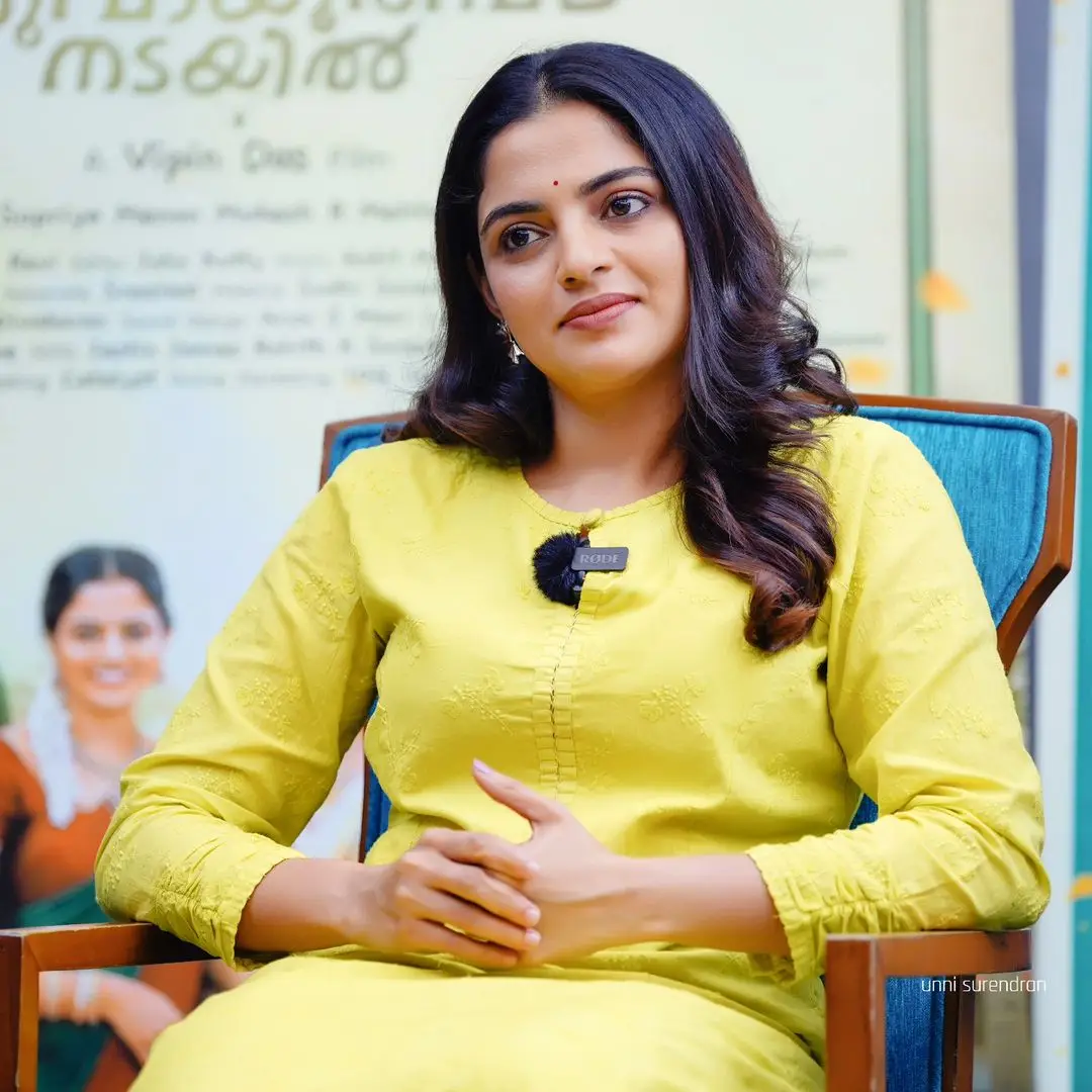 Actress Nikhila Vimal Long Hair Smiling Face Green Gown